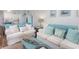 Cozy living room with comfortable seating, beach-themed decor, and open to kitchen and dining at 6001 N Ocean Blvd. # 342, North Myrtle Beach, SC 29582