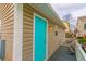 Relax on this back porch featuring a turquoise-painted door and two chairs for seating at 6001-8026 South Kings Hwy., Myrtle Beach, SC 29575