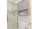 Beautiful bathroom features a glass enclosed shower and storage cabinet above the toilet at 6001-8026 South Kings Hwy., Myrtle Beach, SC 29575