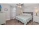 Comfortable bedroom featuring a large bed, natural light, and stylish decor at 6001-8026 South Kings Hwy., Myrtle Beach, SC 29575