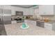 Well-equipped kitchen with granite countertops, stainless steel appliances, and white cabinetry at 6001-8026 South Kings Hwy., Myrtle Beach, SC 29575