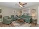 Inviting living room with comfortable seating, stylish decor, and a ceiling fan at 6001-8026 South Kings Hwy., Myrtle Beach, SC 29575