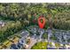 Aerial view of a charming neighborhood with lush green lawns, mature trees, and various home styles at 6239 Chadderton Circle, Myrtle Beach, SC 29579