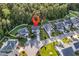 Aerial view of a charming neighborhood with lush green lawns and tree coverage at 6239 Chadderton Circle, Myrtle Beach, SC 29579