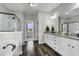 Luxurious bathroom with double vanity, tub, and walk-in shower, complemented by elegant fixtures at 6239 Chadderton Circle, Myrtle Beach, SC 29579
