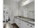 Well-lit bathroom featuring double sinks, granite countertops, and modern fixtures, providing a luxurious feel at 6239 Chadderton Circle, Myrtle Beach, SC 29579