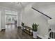 Entryway with hardwood floors, bench, and coat closet at 6239 Chadderton Circle, Myrtle Beach, SC 29579