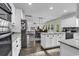 Bright kitchen featuring a center island, granite countertops, and a seamless flow to the living area at 6239 Chadderton Circle, Myrtle Beach, SC 29579