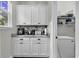 Well-equipped kitchenette featuring white cabinets, granite countertop, and modern appliances at 6239 Chadderton Circle, Myrtle Beach, SC 29579