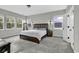 Inviting main bedroom with soft carpeting, natural light, and views of the surrounding landscape at 6239 Chadderton Circle, Myrtle Beach, SC 29579