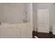 Modern bathroom with a large soaking tub and a built-in linen closet exudes spa-like elegance at 6544 Amberwood Ct., Myrtle Beach, SC 29588