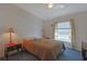 Cozy bedroom with natural light from window, and a ceiling fan for added comfort at 6544 Amberwood Ct., Myrtle Beach, SC 29588