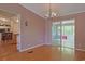 Bright dining room with hardwood floors and a modern chandelier at 6544 Amberwood Ct., Myrtle Beach, SC 29588