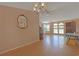 Open-concept dining area, featuring hardwood floors, a decorative mirror, and a light-filled space at 6544 Amberwood Ct., Myrtle Beach, SC 29588