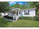 Charming single-story home featuring a welcoming front porch, well-maintained lawn, and mature landscaping at 6544 Amberwood Ct., Myrtle Beach, SC 29588