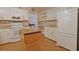 Fully-equipped kitchen showcasing white appliances, plentiful counter space, and a mobile kitchen island at 6544 Amberwood Ct., Myrtle Beach, SC 29588