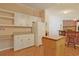 Functional kitchen featuring white appliances, ample storage, and a mobile kitchen island at 6544 Amberwood Ct., Myrtle Beach, SC 29588