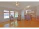 Sunlit living room with wood floors and open access to the kitchen enhances the home's appeal at 6544 Amberwood Ct., Myrtle Beach, SC 29588