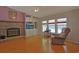 Cozy living room features a stone fireplace and built-in shelving, plus lots of natural light at 6544 Amberwood Ct., Myrtle Beach, SC 29588