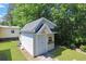 Outdoor shed with durable siding, providing ample storage space with greenery surrounding the structure at 6544 Amberwood Ct., Myrtle Beach, SC 29588