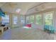 The sunroom is spacious and well-lit, with plenty of windows and skylights, perfect for relaxing at 6544 Amberwood Ct., Myrtle Beach, SC 29588