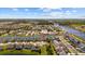 Beautiful aerial view of a lakeside community with a resort-style pool and clubhouse at 6591 Cagliari Court, Myrtle Beach, SC 29572