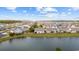 Stunning aerial view of a lakeside community featuring well-maintained homes and lush landscaping at 6591 Cagliari Court, Myrtle Beach, SC 29572