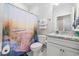 Bathroom with a white vanity and marble countertop with a shower/tub combination at 6591 Cagliari Court, Myrtle Beach, SC 29572