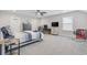 Bedroom with a ceiling fan, desk, and a window providing natural light at 6591 Cagliari Court, Myrtle Beach, SC 29572