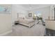 Bedroom with neutral tones, a ceiling fan, carpet floors, and a large window at 6591 Cagliari Court, Myrtle Beach, SC 29572
