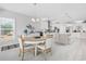 Bright dining area features a modern chandelier, decorative accents, and easy access to the kitchen at 6591 Cagliari Court, Myrtle Beach, SC 29572