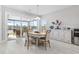 Cozy dining area boasts a view of the screened-in patio and the water at 6591 Cagliari Court, Myrtle Beach, SC 29572