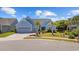 Charming, single-story home with manicured lawn, mature landscaping, and a two-car garage at 6591 Cagliari Court, Myrtle Beach, SC 29572
