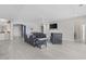 Spacious living room with modern furniture, fireplace, and a view into the kitchen at 6591 Cagliari Court, Myrtle Beach, SC 29572