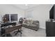 Well-lit home office with large monitors, comfortable seating, and ample workspace at 6591 Cagliari Court, Myrtle Beach, SC 29572