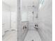 Modern walk-in shower with sleek tiling, rainfall showerhead, and built-in niche at 6591 Cagliari Court, Myrtle Beach, SC 29572