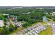 Aerial view of homes in the Heather Glen community with surrounding woods and neighborhood pond at 662 Wallace Dr., Little River, SC 29566