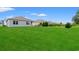 Expansive green backyard featuring well-maintained lawns and neighboring homes at 662 Wallace Dr., Little River, SC 29566