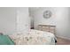 Bedroom with natural light, a bed, dresser, and decorative clock at 662 Wallace Dr., Little River, SC 29566