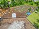 Aerial view of the community garden with raised beds, gardening shed and benches at 662 Wallace Dr., Little River, SC 29566