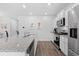 Well-equipped kitchen with stainless steel appliances, granite countertops, and wood flooring at 662 Wallace Dr., Little River, SC 29566