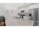 Modern kitchen features stainless steel appliances, granite countertops, and island sink at 662 Wallace Dr., Little River, SC 29566