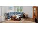 Comfortable living room features a large sectional couch and natural light at 662 Wallace Dr., Little River, SC 29566