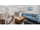 Open-concept living room featuring modern furnishings and seamless flow to kitchen at 662 Wallace Dr., Little River, SC 29566