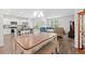 Open-concept living space featuring kitchen, dining area, and living room with ample natural light at 662 Wallace Dr., Little River, SC 29566
