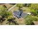 Beautiful home with mature trees, a new roof and detached carport on a sunny day at 675 Liberty Church Rd., Loris, SC 29569