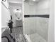Well-appointed bathroom with a glass-enclosed shower and view into vanity area with decorative patterned tile floor at 675 Liberty Church Rd., Loris, SC 29569