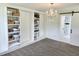 Elegant bedroom with chandelier, built-in shelves and an adjacent bathroom with sliding barn door at 675 Liberty Church Rd., Loris, SC 29569