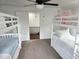 Bedroom featuring white bunk beds with views of the staircase and outdoor scenery at 675 Liberty Church Rd., Loris, SC 29569