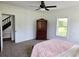 Well lit bedroom featuring neutral carpet, natural lighting and a traditional wardrobe at 675 Liberty Church Rd., Loris, SC 29569